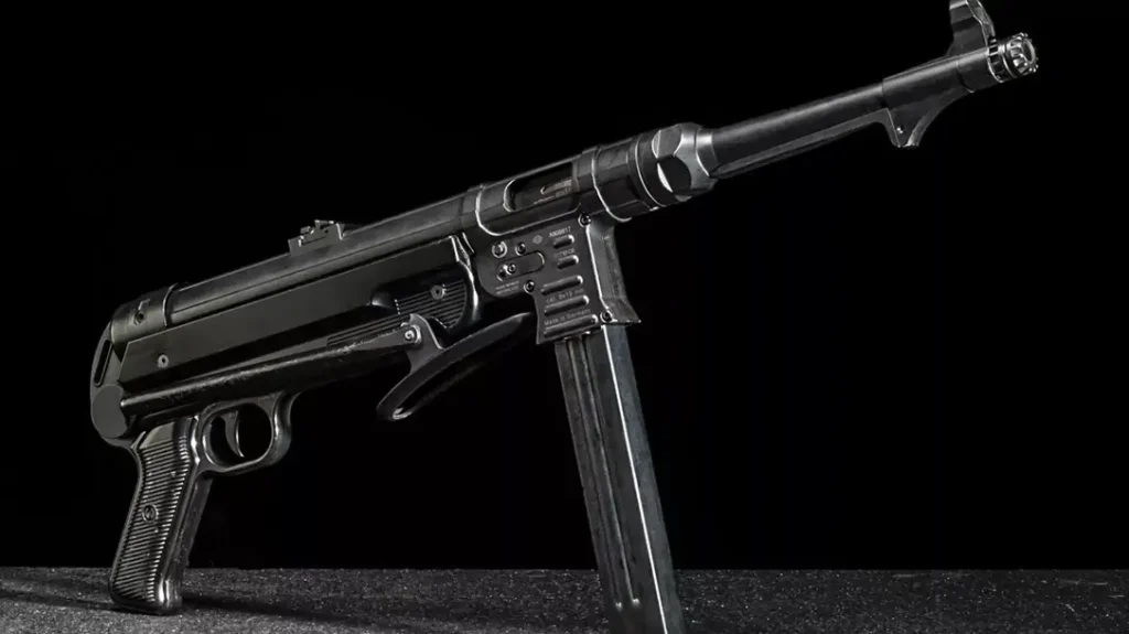 The folding stock brought the MP40’s overall length down to just 24.8 inches, and its extensive use of sheet metal kept its unloaded weight to 8.75 pounds—much lighter than the American Thompson.