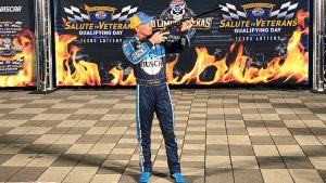 Henry presented Kevin Harvick with a rifle for winning the pole in Texas. 