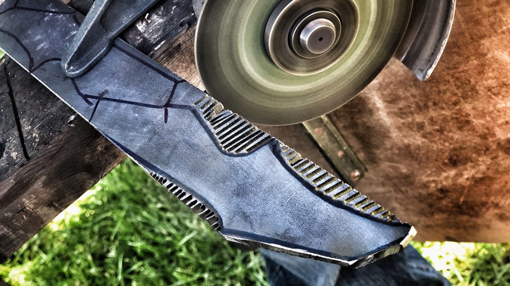 Then, using an angle grinder, they cut out the rough shape of the blade.