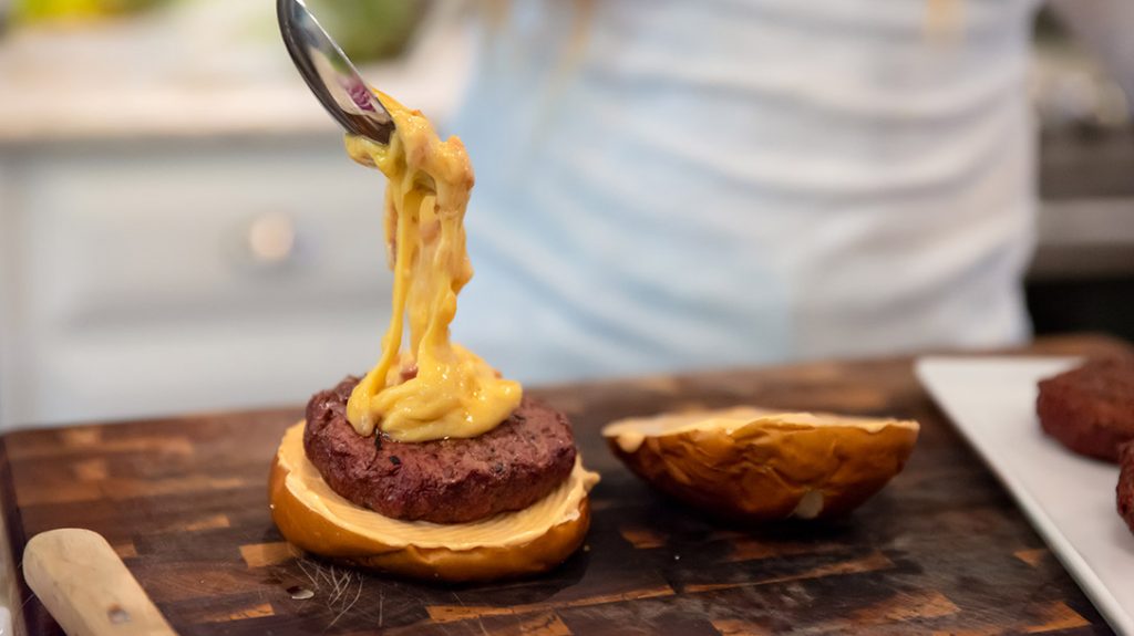 Top the wild game burgers with the cheese while it is hot.