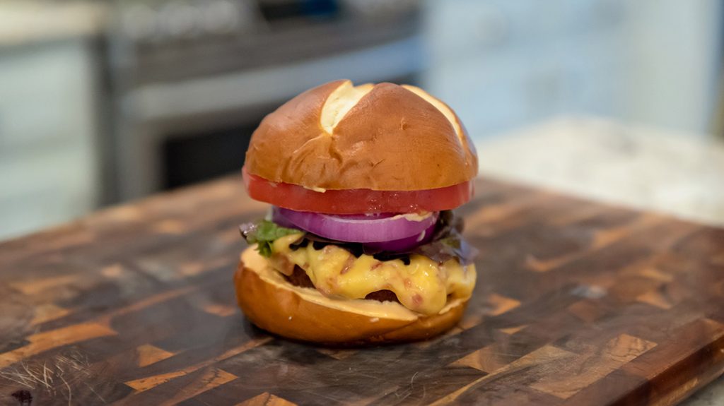 Finally, add your lettuce, tomato and onion and your wild game cookout is off to a great start.