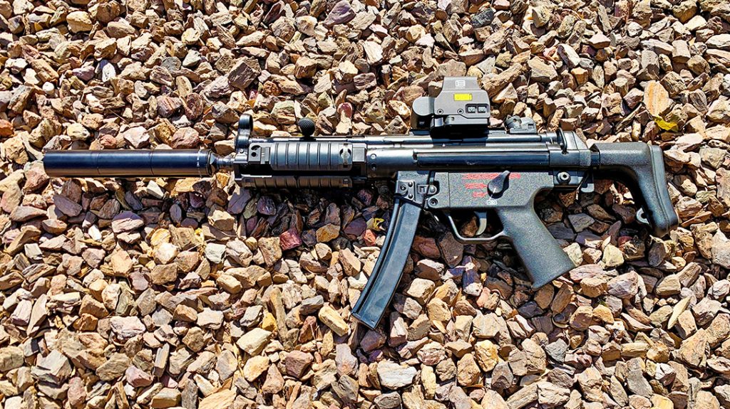A select-fire MP5 SMG with a thread-on SEG H 9mm suppressor.