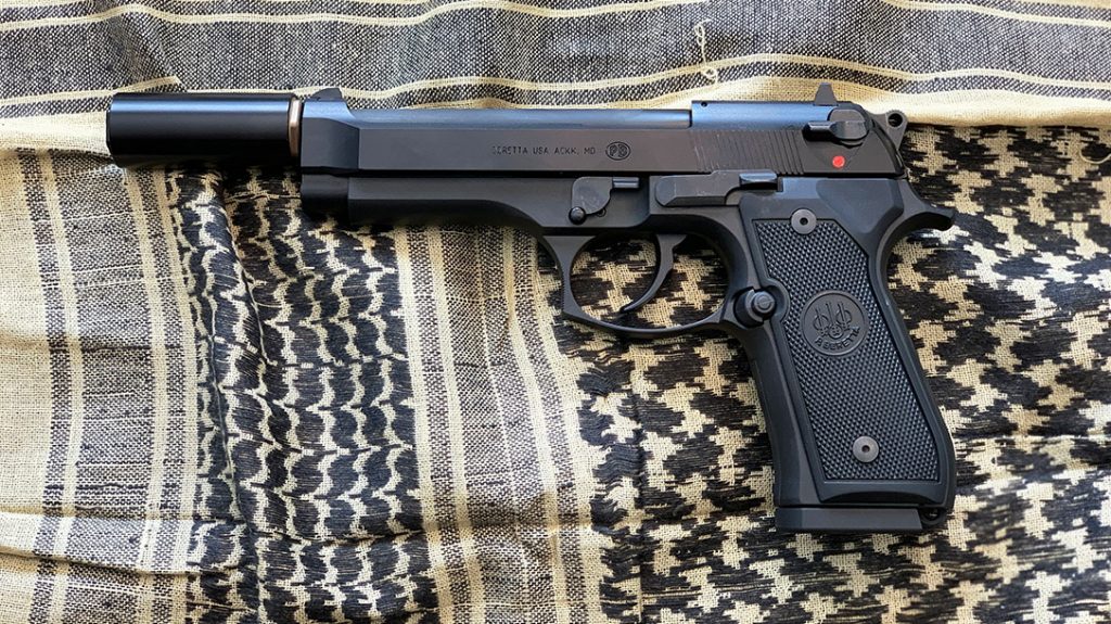 A Beretta M9-22 with the short Rex Silentium COV 22 mini suppressor in .22 LR.