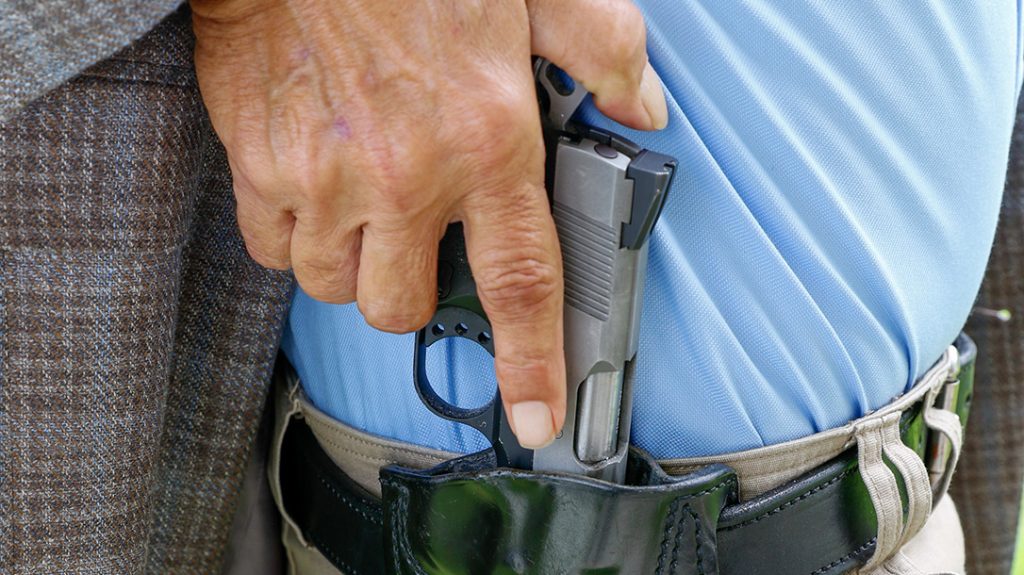 Holster your pistol before police arrive at shooting scene. Shown: Colt CCO .45, cocked and locked in Mitch Rosen holster.