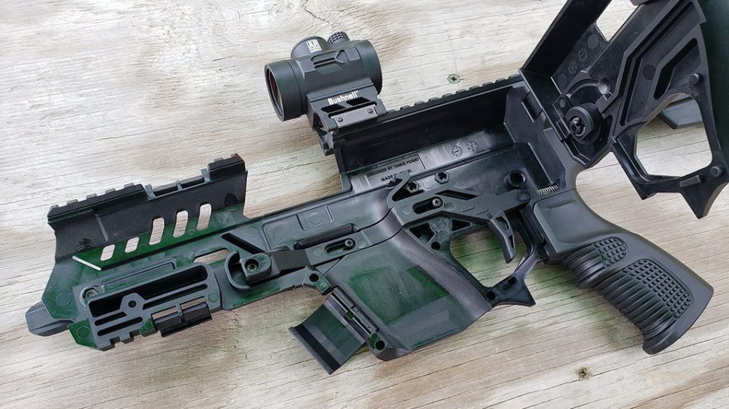 The Recover Tactical P-IX clamshell is secured by three latches and hinges to the side.