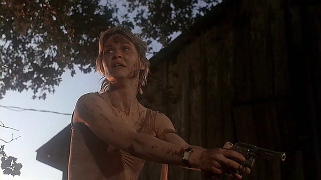 Donna faces off against Cujo, armed with a Smith & Wesson Model 64.