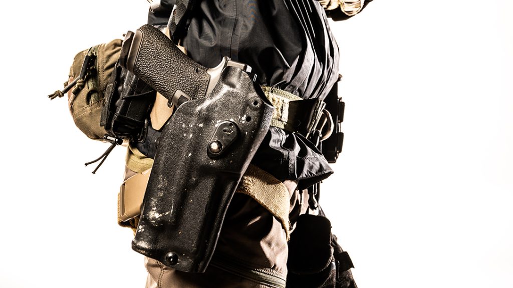 A Glock carried in a modern Kydex holster