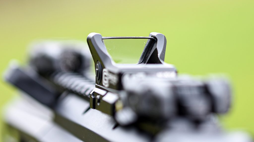 The lack of a top strap provides a less obstructed field of view and lower profile.