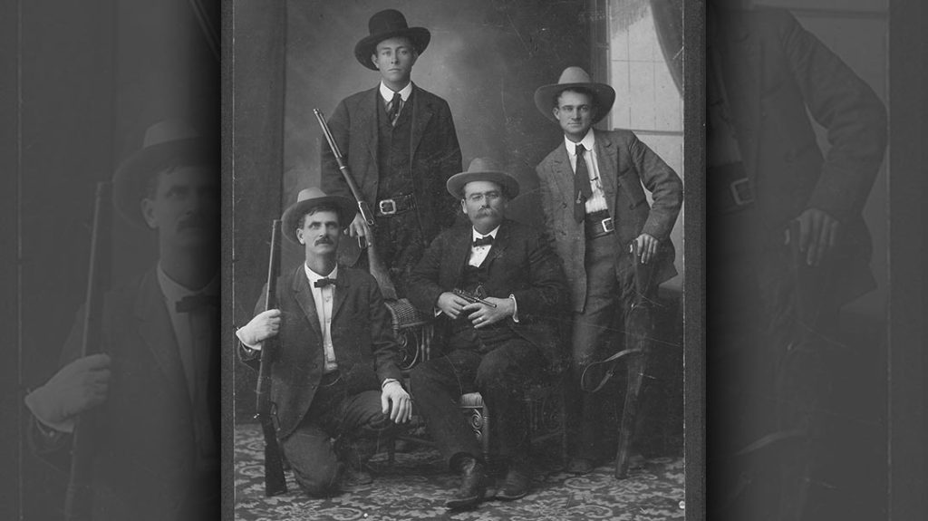 This 1906 photo shows an older Ranger with his 1873 Winchester, while the younger men behind him have flat-shooting Winchester Model 1894 Carbines. The Ranger on the left is a young Frank Hamer. Captain John H. Rogers has his exotic P08 Luger. The Luger was a real oddity and was recovered at a crime scene rather than purchased. – A look into Texas Rangers History.