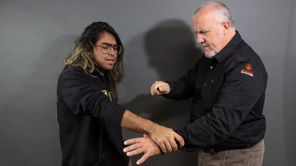 The attacker grabs your wrist.