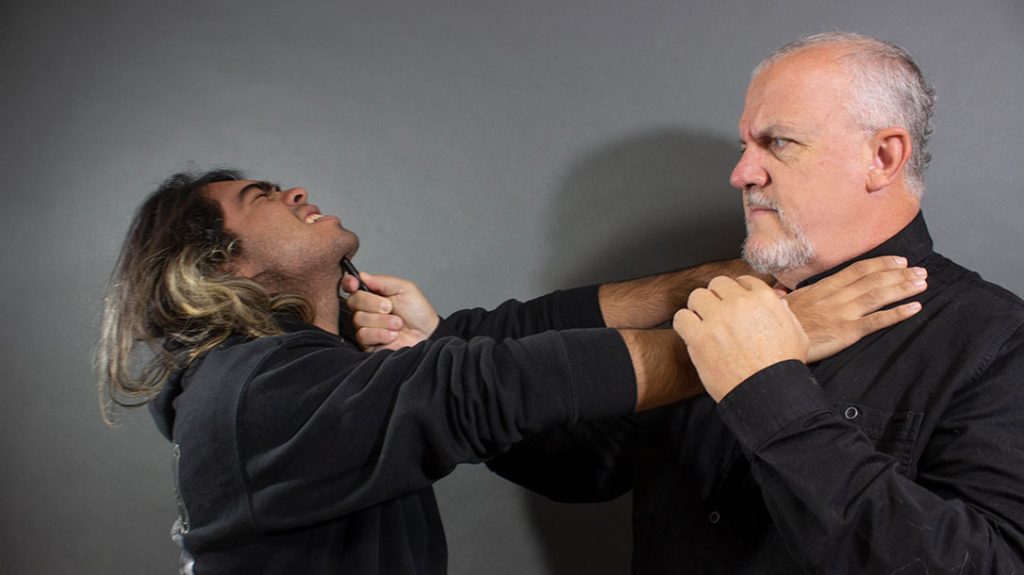 You drive the tip of your pen up into the underside of his chin.