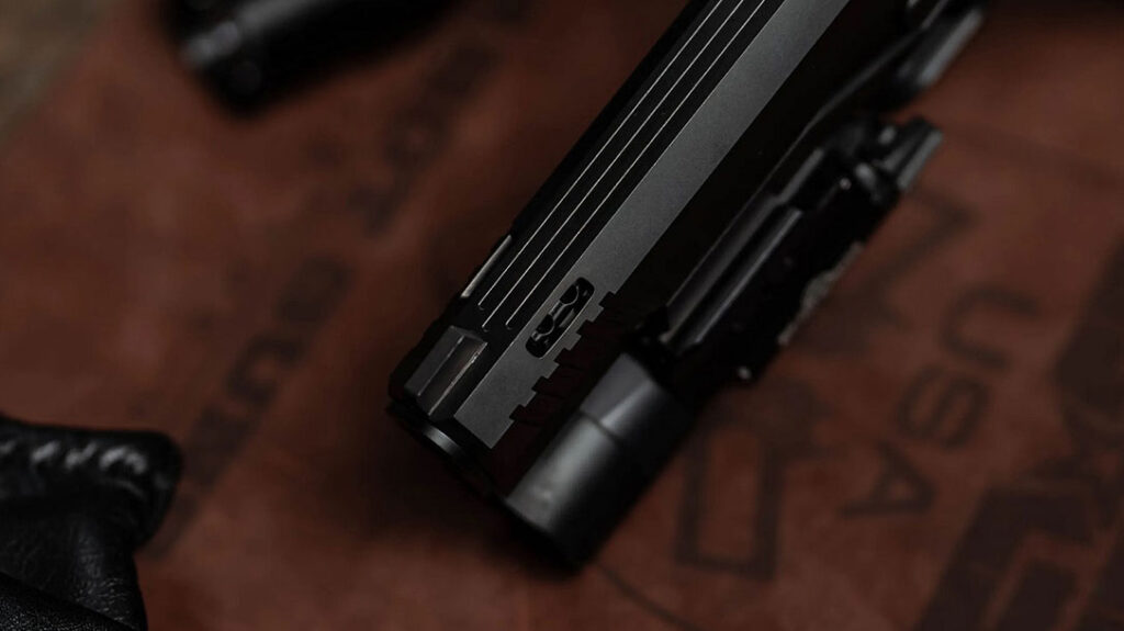 The slide includes cuts to take advantage of the barrel porting.