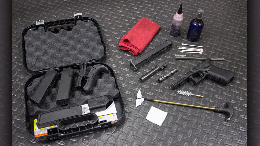 Cleaning a pistol set up.