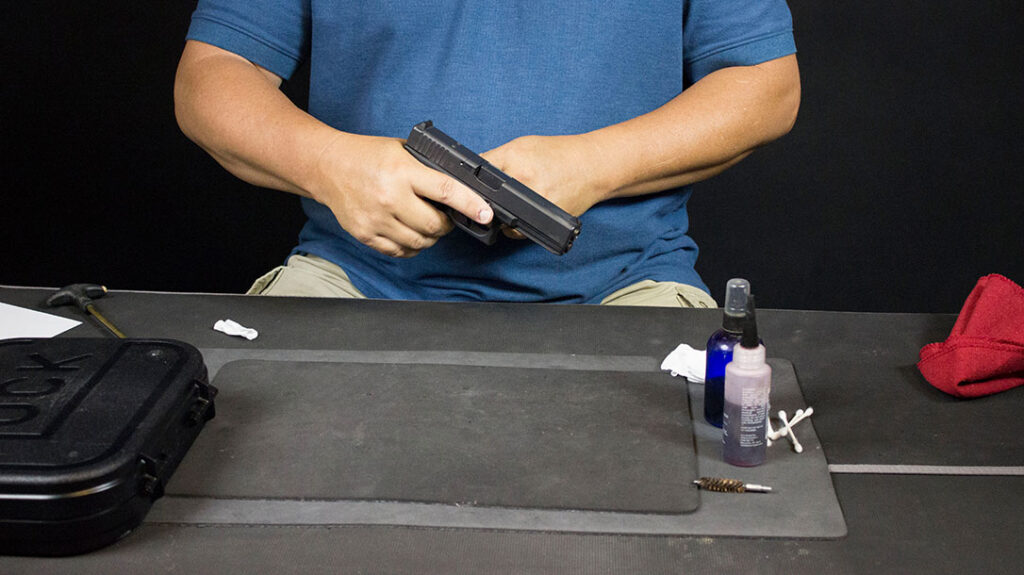 After cleaning a pistol, make sure it is still unloaded and perform function checks.
