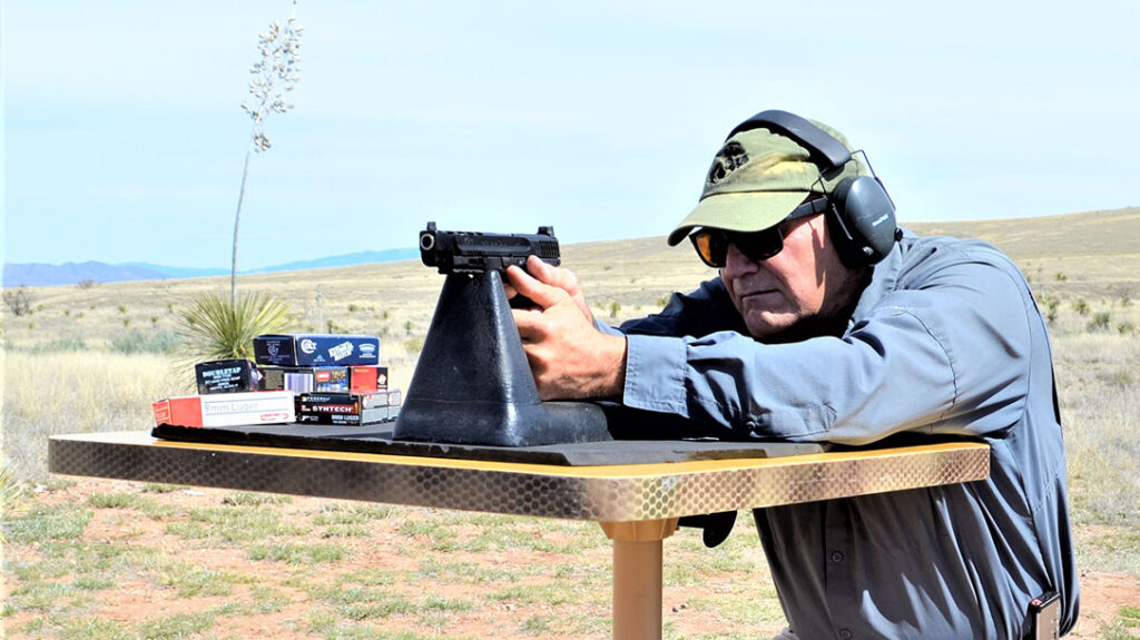 The author shooting the Smith & Wesson Performance Center M&P9 M2.0 C.O.R.E. from a bench rest.