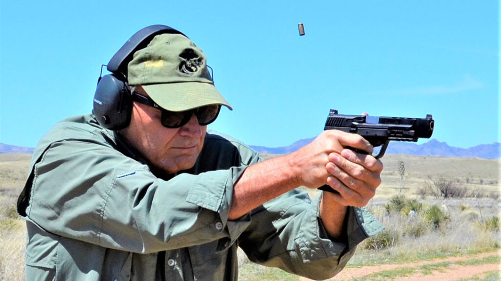The author shooting the Smith & Wesson Performance Center M&P9 M2.0 C.O.R.E. from a standing position.