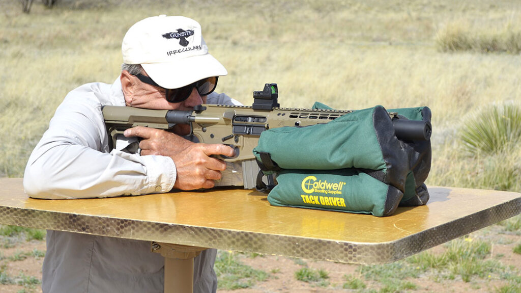 The author shooting a home defense SBR from the bench.