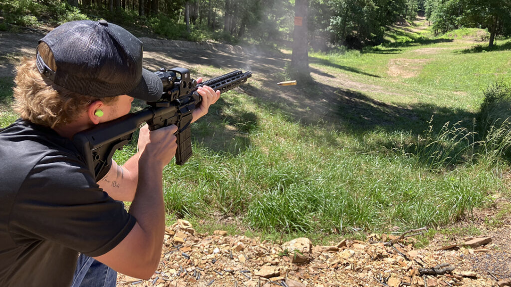 Engaging targets from the kneeling position at EVTC Origin Shooting 3-Gun Range.  
