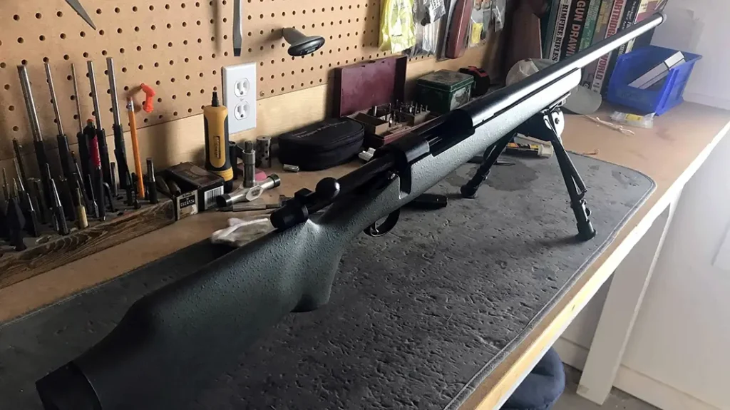 Bolt-action rifle on the work bench.