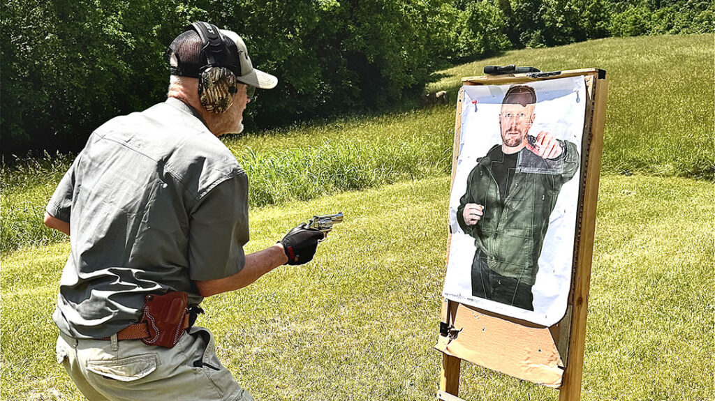 The author running a self-defense drill on the range.