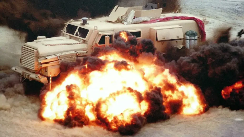 A Cougar MRAP is shown undergoing STANAG blast test.