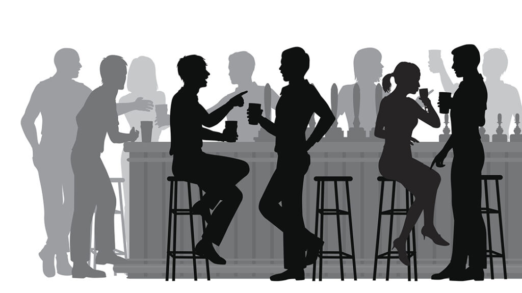 people drinking in a busy bar