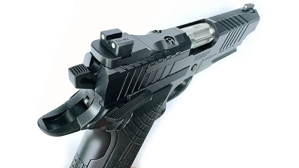 The Kimber KDS9c Rail 1911 is optics ready; the TruGlo tritium rear sight is mounted on the cover plate; the front sight is also from TruGlo; note the hammer and ambidextrous safety.