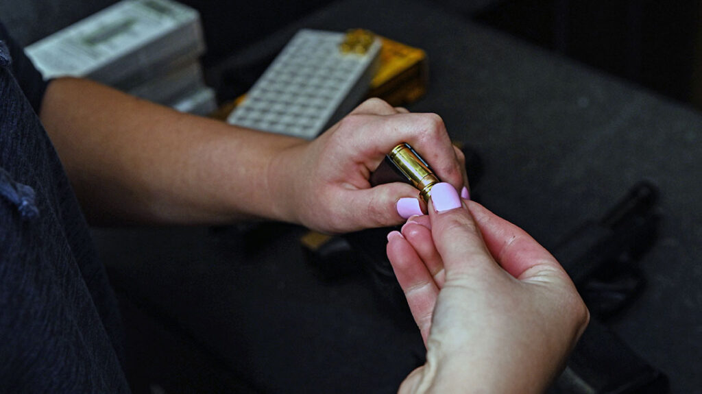 The author loads a magazine.