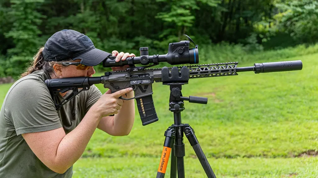 The author on the gun with a thermal optic and suppressor. 