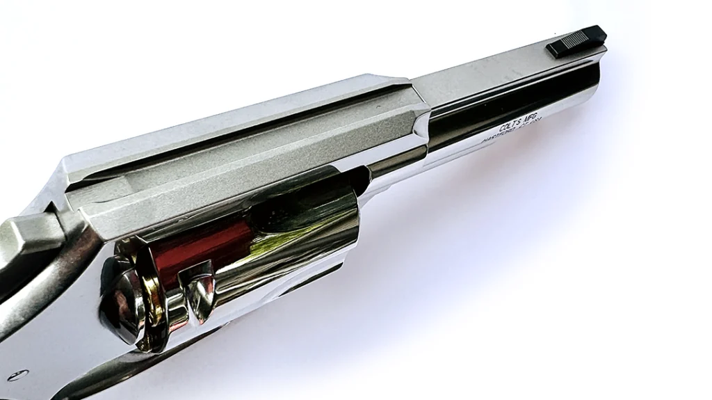 Here is the square-notch rear sight and its channel in the frame top-strap of the Colt Viper 357, along with the barrel rib and black, serrated ramp front sight.