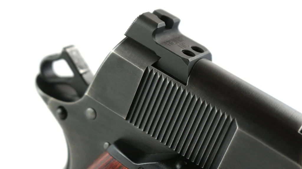 In one move, the Nighthawk Custom Shop gunsmith corrected both issues by milling away the damaged material and creating wider Novak dovetails.