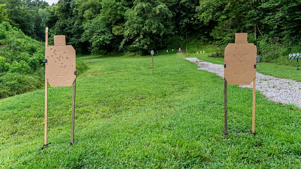 Set up two paper targets five to seven yards away with a wide gap between them and a steel target in the middle of the paper targets, 10 yards or further back from them.