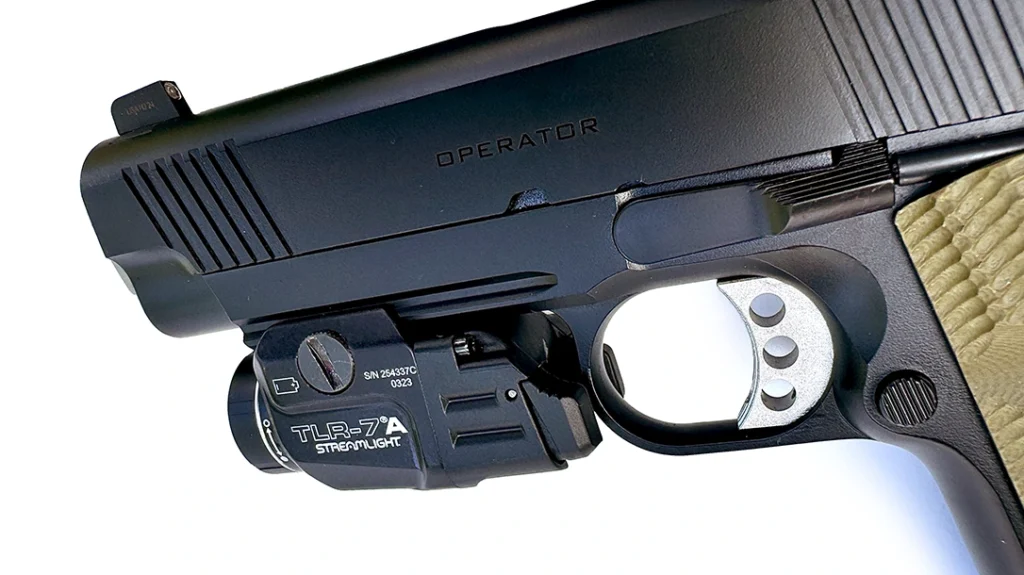 Integral with the frame dustcover on the Operator is a 3-slot Picatinny rail; it worked well with the author’s Streamlight TLR-7A tactical light.