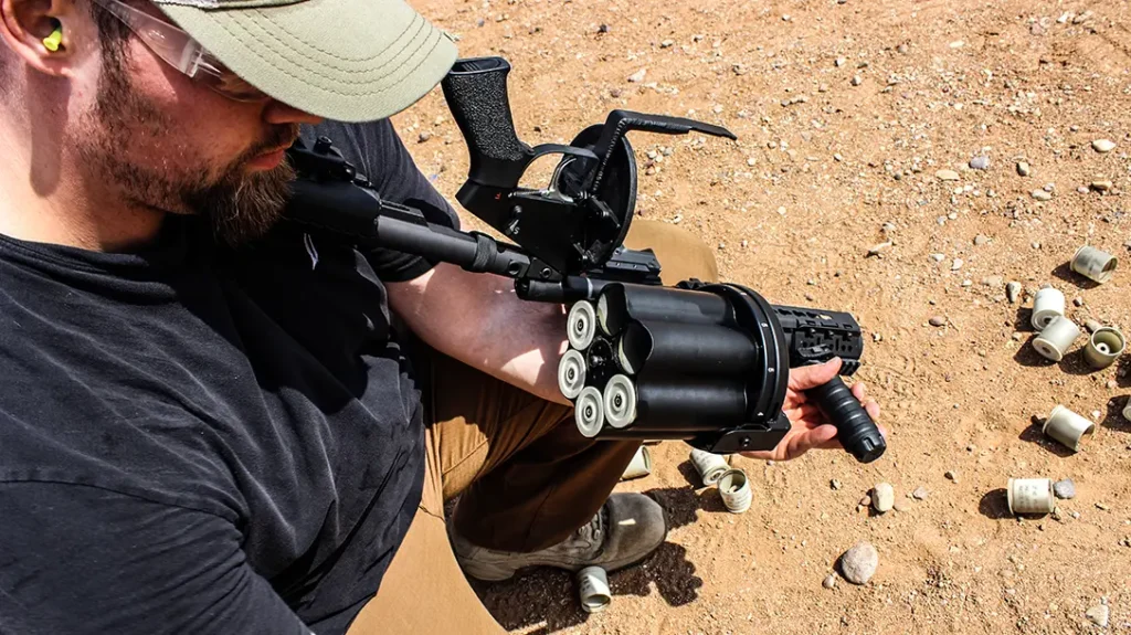 Loading the Milkor 40mm Grenade Launcher.