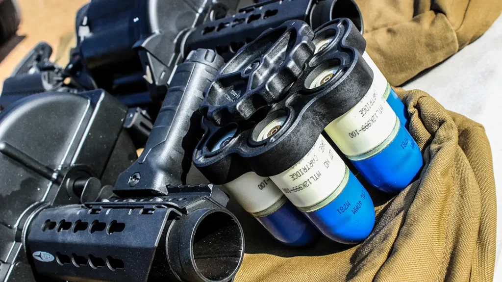 Speed loader with 40mm training rounds.