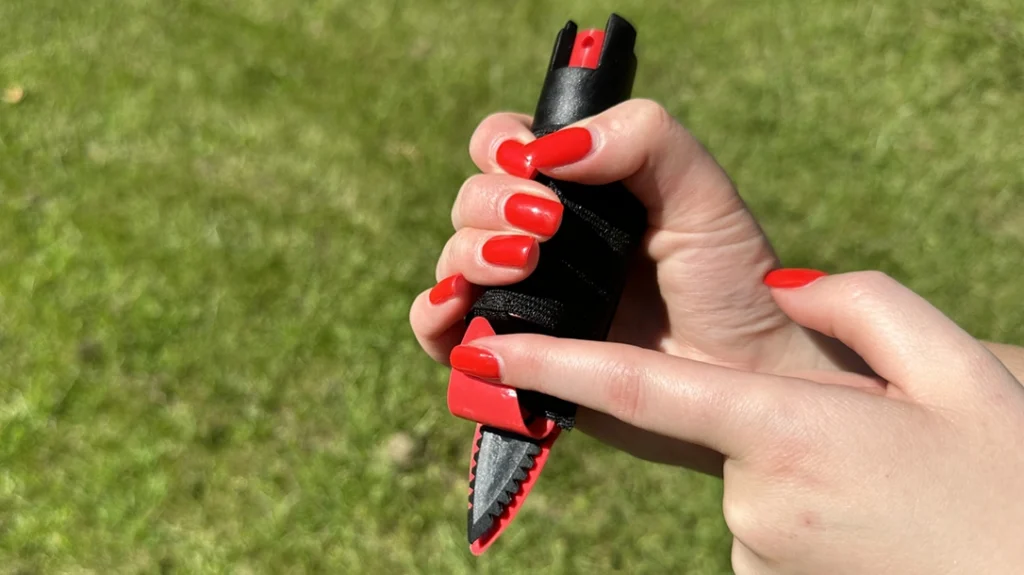 The Hand-Held With Pepper Spray has a hidden, serrated knife.