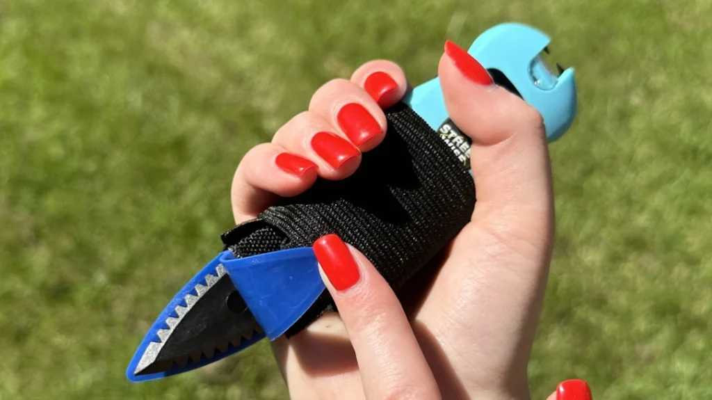 The Hand-Held with Stun Device has a hidden, serrated knife.