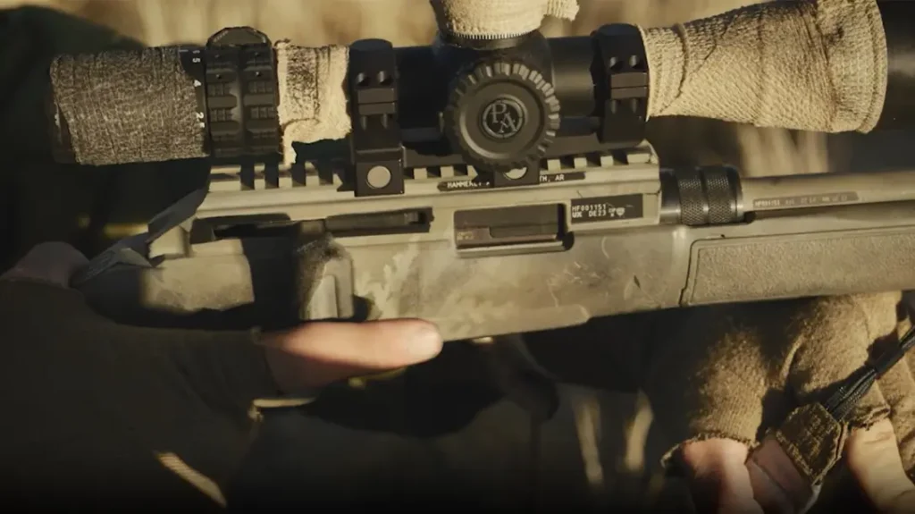 The rifle uses a side charging handle.