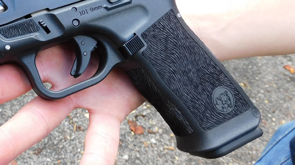 The first thing I noticed about the pistol’s frame, other than the obvious Glock grip angle, was the “Bear Fur” stippling on the grip’s sides, front, and back.