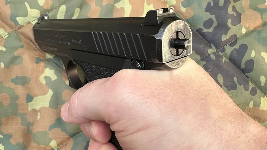 This gun has a low bore axis, and a fixed barrel, allowed by a gas system that doesn’t require a rotating or tilting barrel.