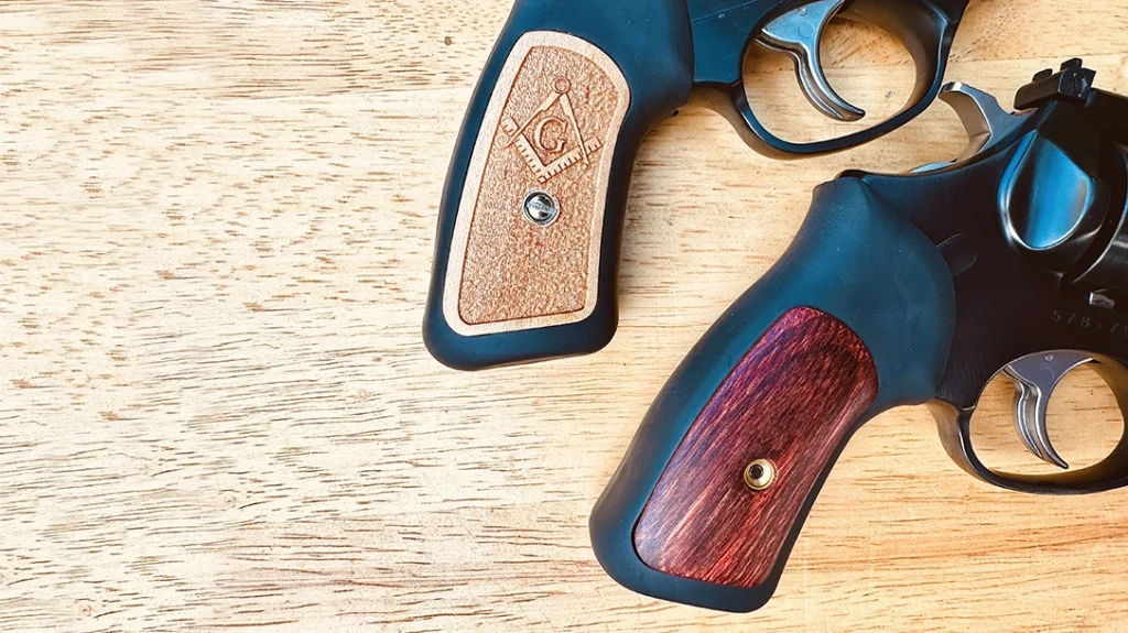 The black rubber grips have a laminated wood insert (bottom); the author dressed up the Lipsey’s Ruger SP101 with custom inserts from LS Grips.