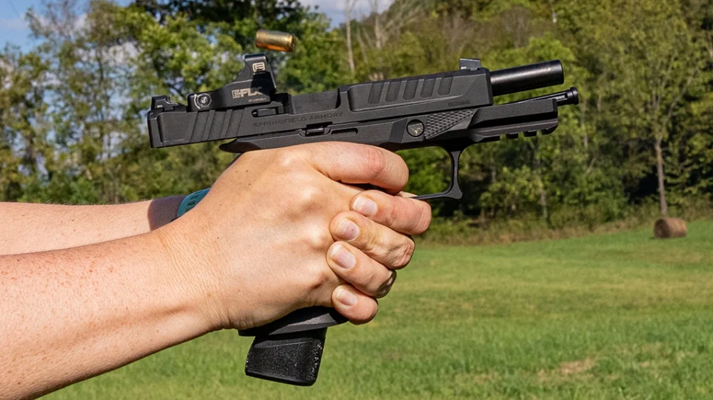 The author shooting the Echelon with the Sharps Bros grip module.