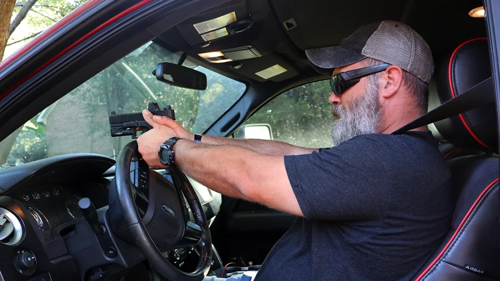 When shooting through the windshield, you can use the steering wheel for support.