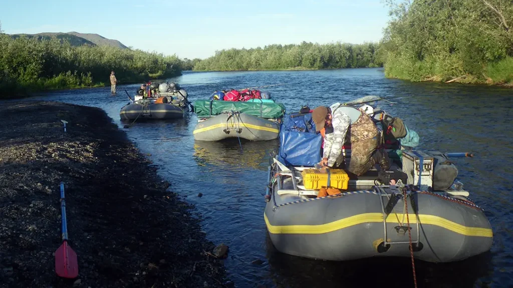 Fully loaded 16-foot rafts on the Kanektok River in Alaska.