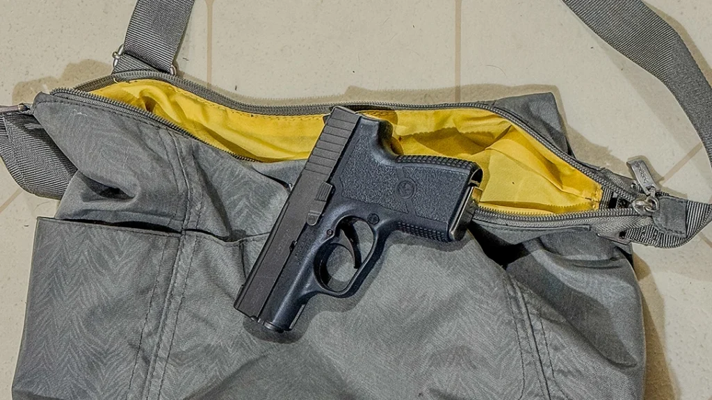 Carried in an unattended purse, this Kahr PM9 9mm is up for grabs for anyone who wants to grab it.