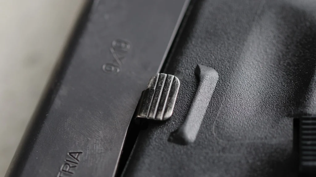 Small parts show healthy wear. The slide stop has lost some of its finish.