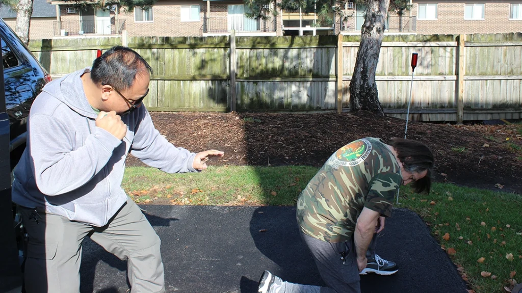 Improvised Vehicle Weapons: Frank steps back, prepared to continue the fight. Don is down after the knee kick. Frank returns to his vehicle and leaves.