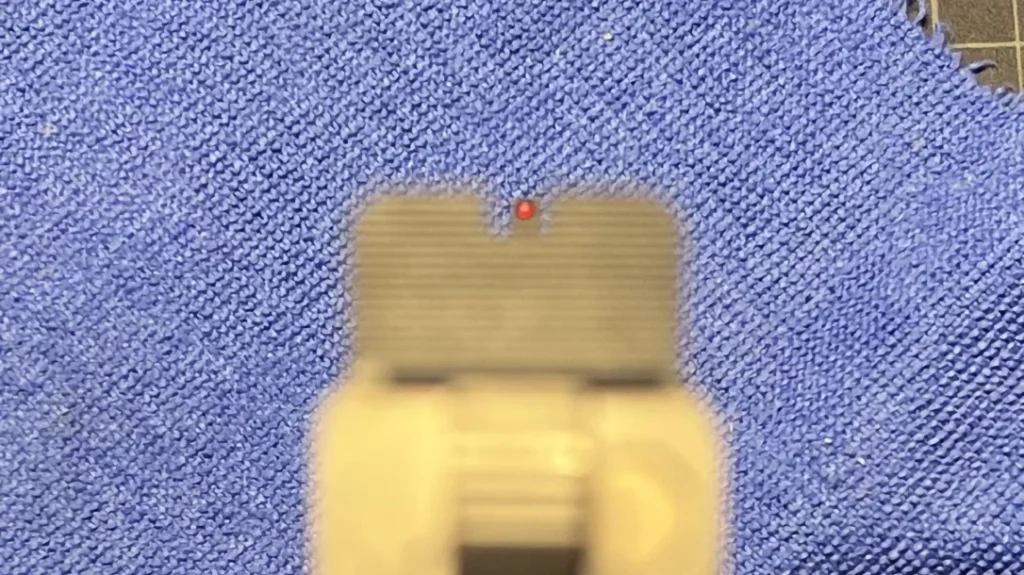 The front sight should be crisp, aligned with the top of the rear sight, and centered.