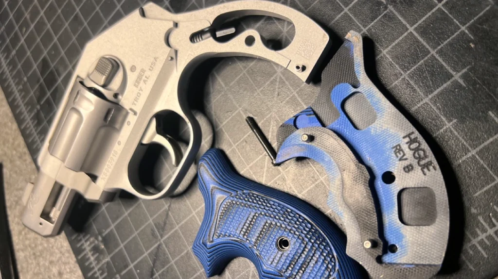 The author upgraded to a Hogue Piranha G10 grip.