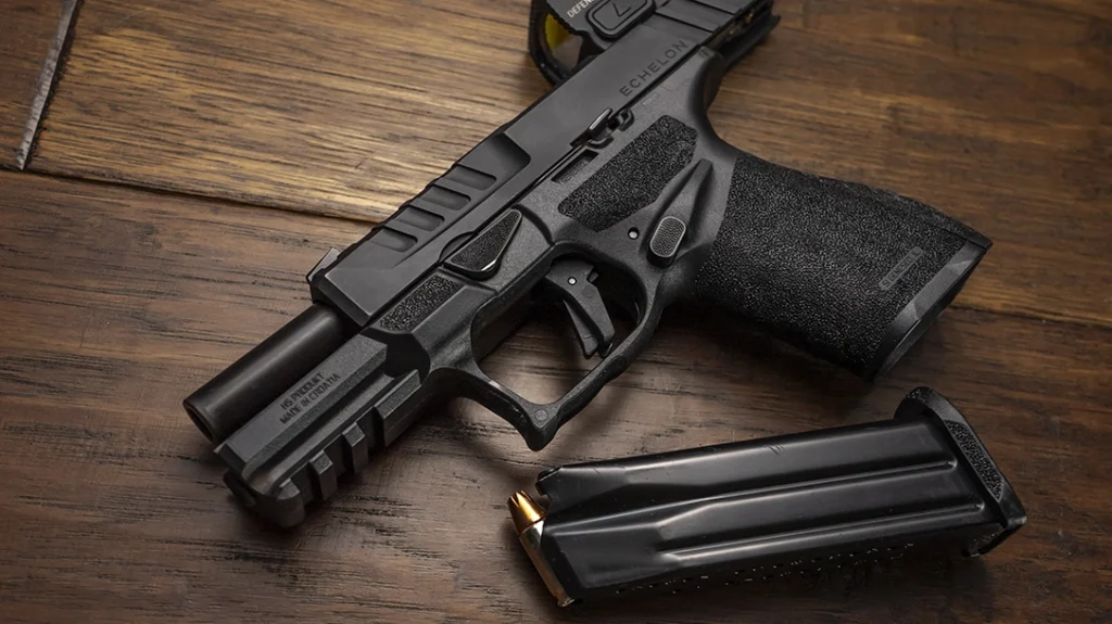 The slide is muscular, while the grip descends into something more refined, civilized, and truly ergonomic.